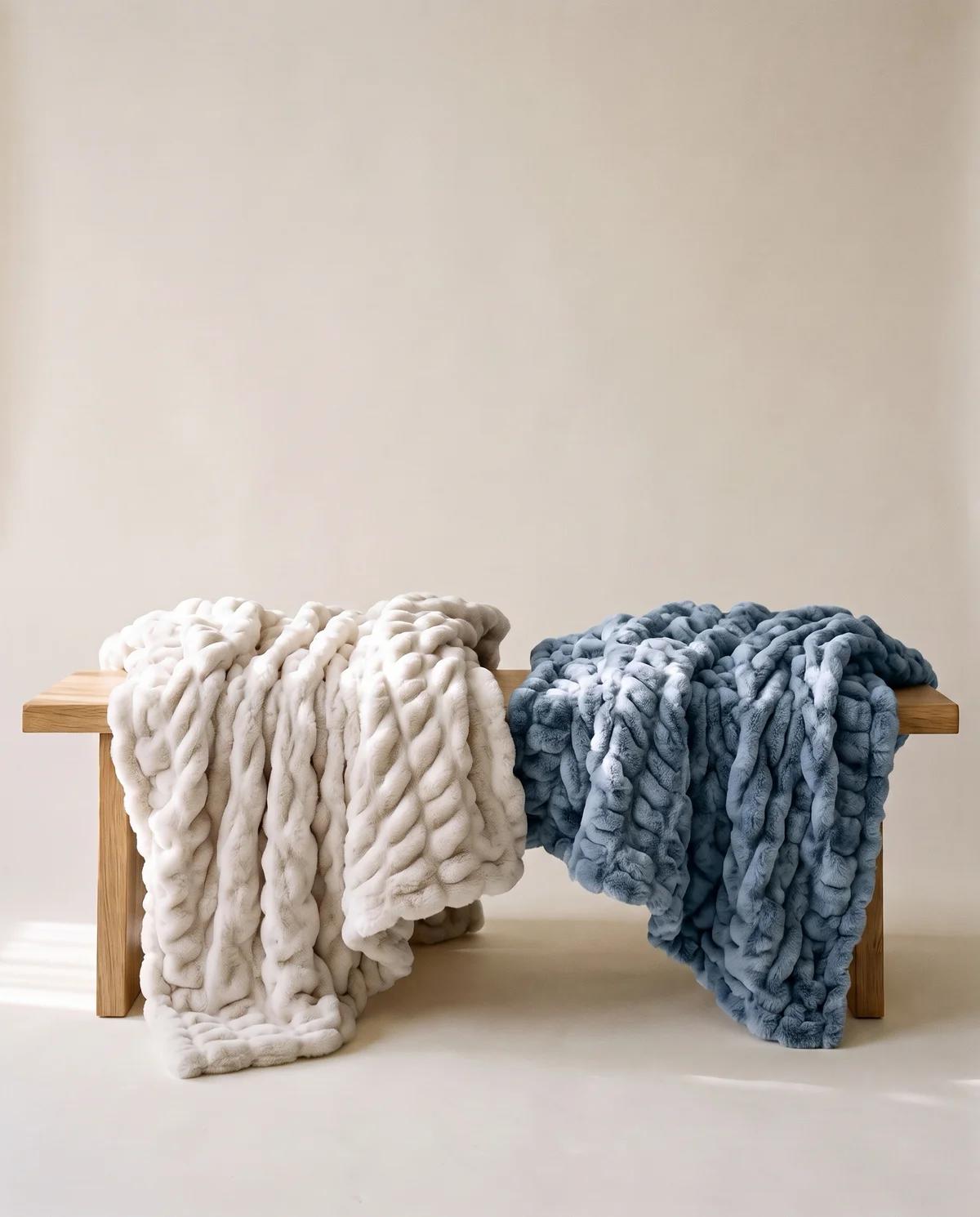 Cream and Bluebird blankets draped over a wooden bench