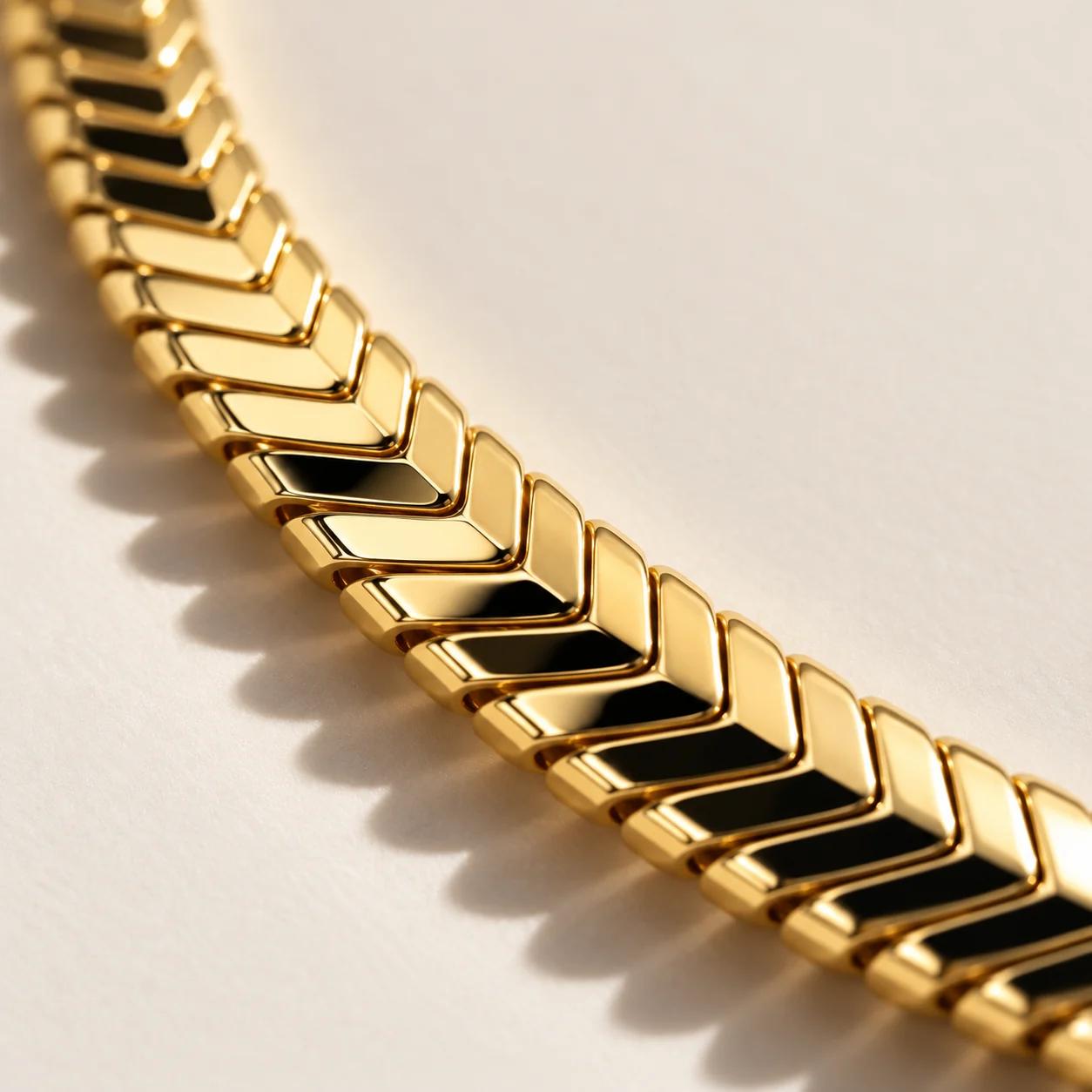 Close-up of a gold chevron herringbone necklace