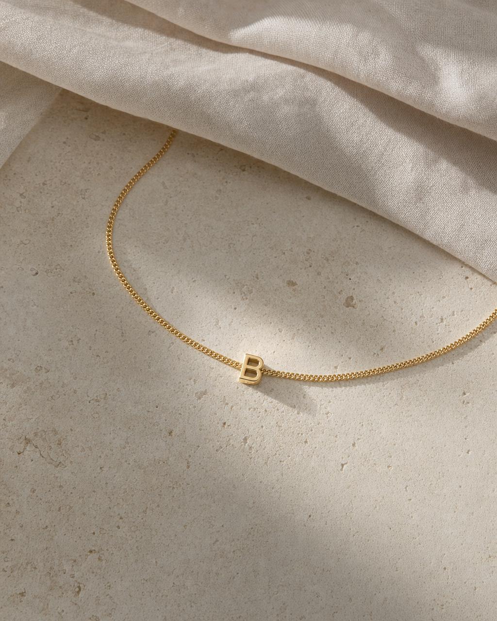 Cove Alphabet Necklace — Flat lay