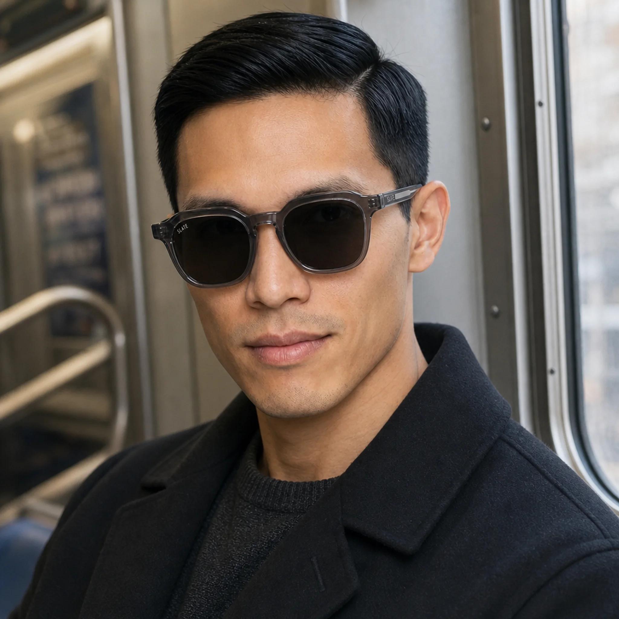 Man wearing Slate Basin sunglasses on a New York City subway