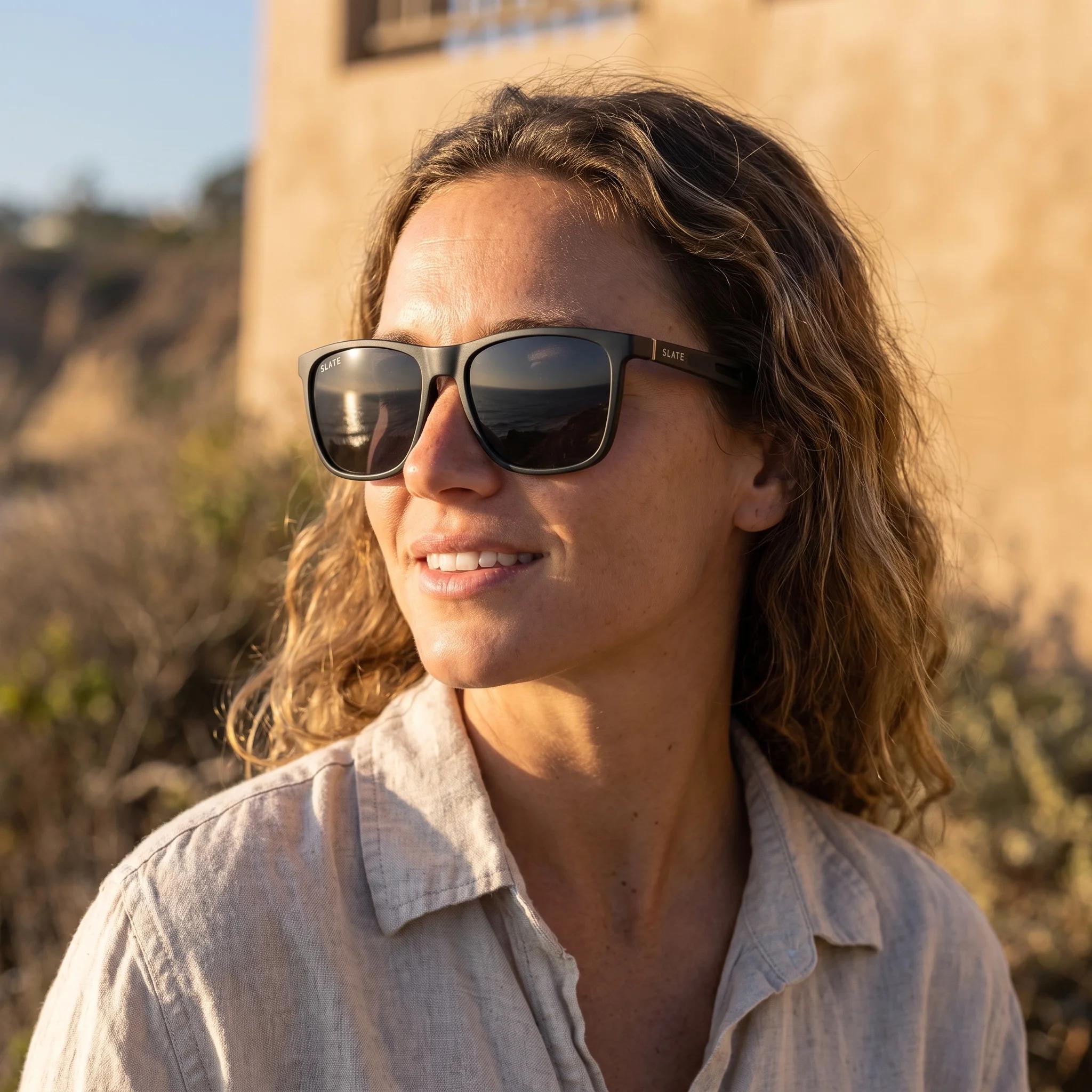 Woman wearing Slate Mesa sunglasses by the coast