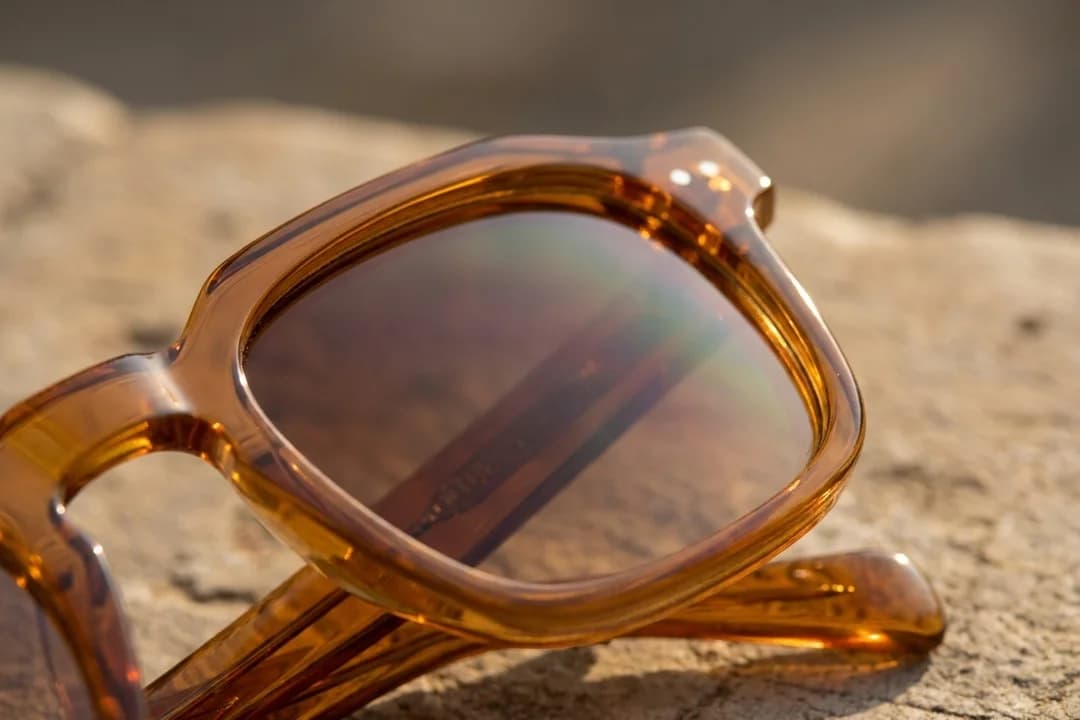 Close-up of amber Slate sunglasses showing translucent acetate depth