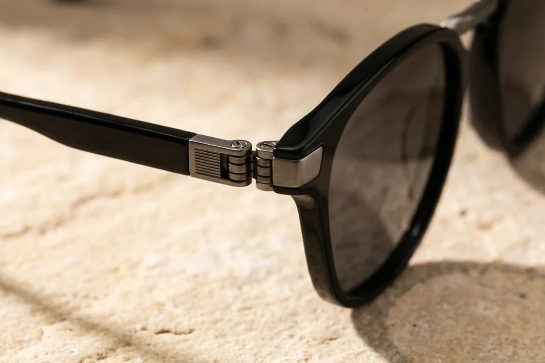 Close-up of Slate sunglasses showing 5-Point Flex hinge construction