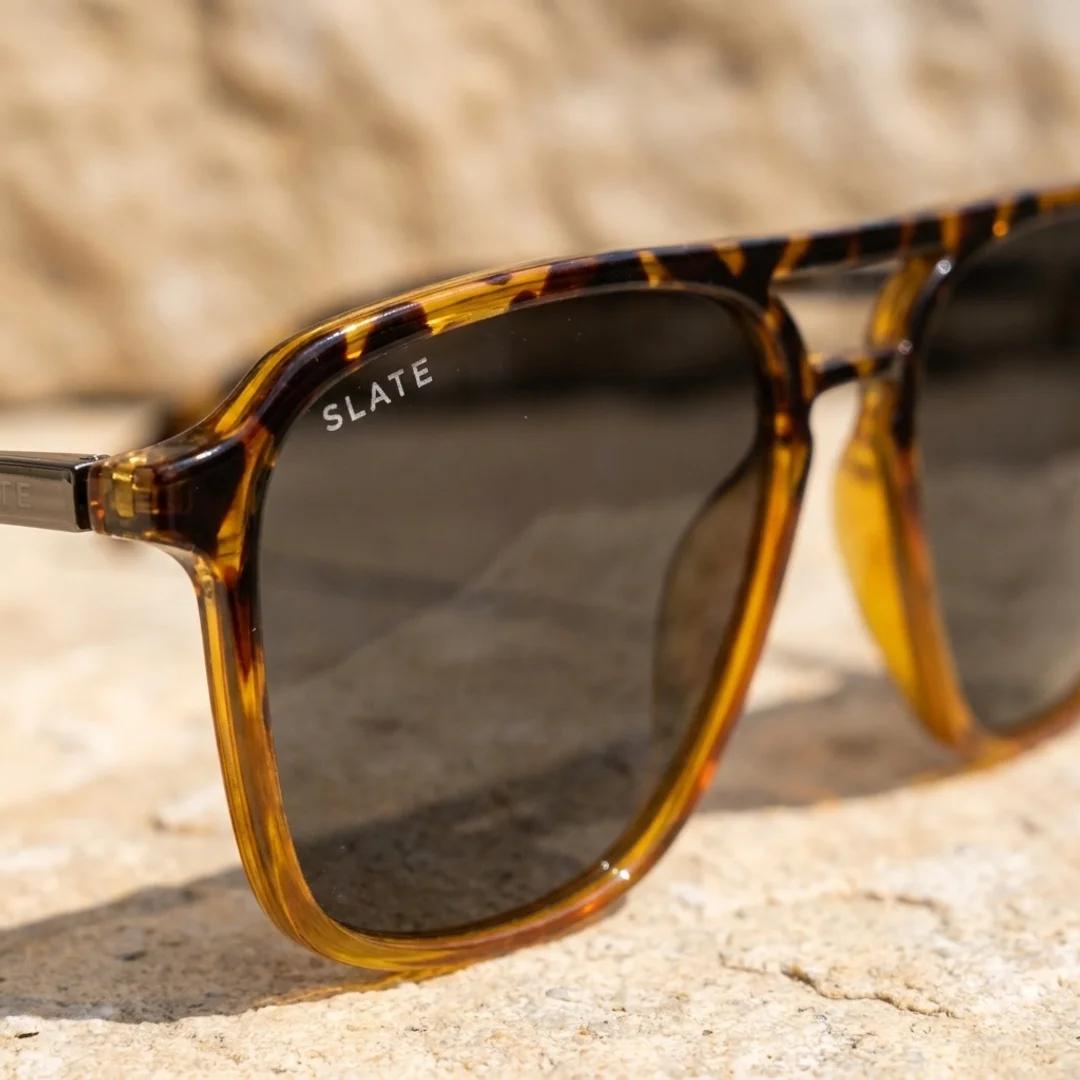 Close-up of Slate sunglass lenses showing the coated SlateShield surface